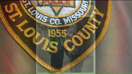 Police Officers Help Man Tie His Tie Before Job Interview