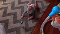 Lazy baby refuses to crawl to grab bottle