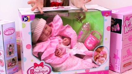 Girl playing with silicon baby doll - change diaper, feed baby and kids car ride on hot wheels