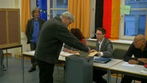 Germany starts voting as history beckons for Merkel