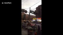 Falling billboard smashes cars in heavy China winds