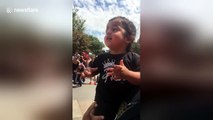 Toddler is overly excited to see Mickey Mouse at Disneyland