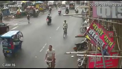 Heroic man saves child after bombs thrown at shop on busy road