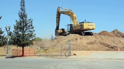 Excavator video: loading trucks on busy construction site (Kids video)