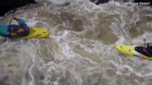 Footage shows kayaker navigating choppy waters with friends before capsizing
