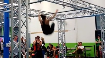 Girl Falls on Her Butt while Flying Between Bars