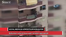 Balkondan sarkarak boya yaptı, yürekleri ağza getirdi