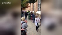 Catalan voters applaud arrival of local police at polling station