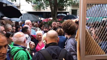 Catalan voters cheered by locals as the leave polling station