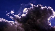 Sun over dark storm clouds - HD animated background loop video, animation,free download