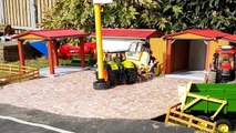 RC BRUDER tror Claas Axion rides through Bruder village