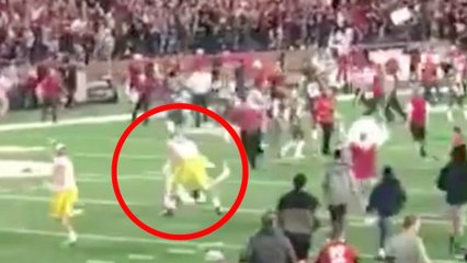 USC Player in Full Gear Completely LEVELS Washington State Fan for Rushing the Field