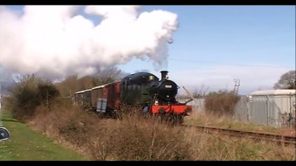 Steam Engine Starts Off Pulling a Goods Train