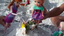 ANNA s SANDCASTLE ! Beach Playing! Elsa and Anna toddlers have fun sliding and jumping in the sand