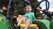 Cute Boy Drives John Deere Tror. Trors for Kids. Video for Children. John Deere Toys