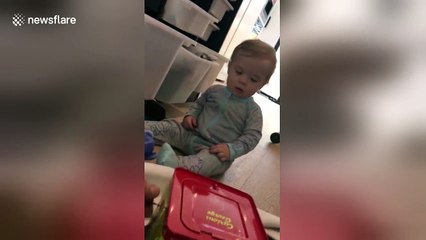 Baby gets terrified by Jack-in-the-box
