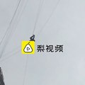 Man-stuck-mid-air-after-trying-to-skip-hotel-bill-using-telecom-wires-between-two-buildings