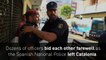 Spanish & Catalan police embrace as conflict subsides