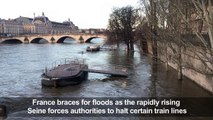 Seine tops its banks after heavy rain batters France