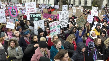 Marchers gather outside Downing St in London for "Time's Up"