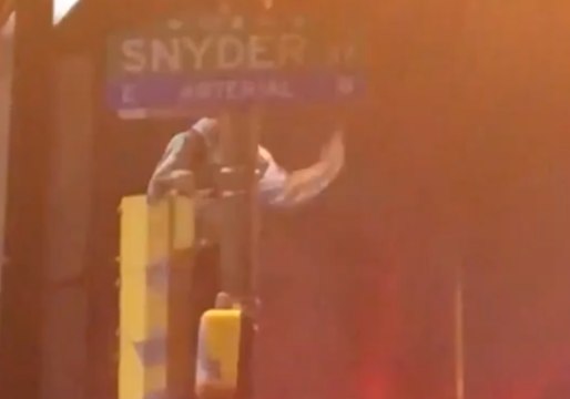 Ecstatic Eagles Fan Scales Greased-Up Lamppost After Super Bowl Qualification