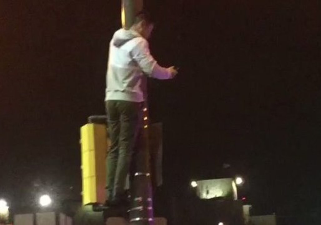 Man Scales Lamp Post During Celebration of Philadelphia Eagles Victory