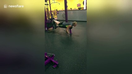 January gym enthusiast does front crawl on lat pulldown machine