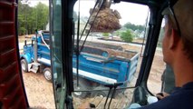 Excavator Loading More Trucks