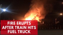Fire erupts after train hits fuel truck