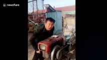 Man's bizarre technique cranking up tractor