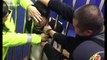Drunk man gets head stuck in guardrails in police detention