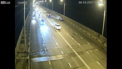 Riderless motorcycle crashes into another car on a bridge
