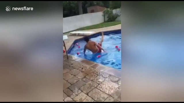 Man slips on diving board while attempting stunt jump into pool