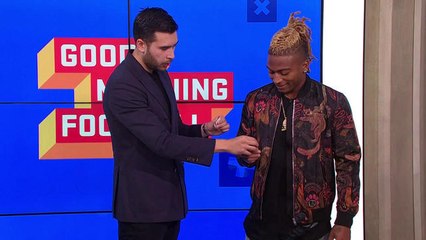 Magician Dan White performs magic tricks with Buster Skrine