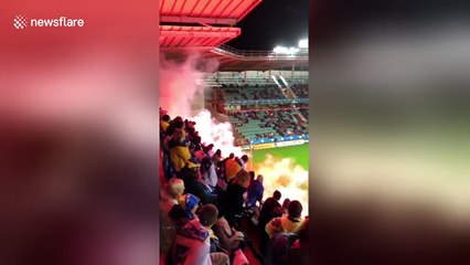 Bosnia soccer fans throw flares onto pitch
