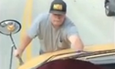 Lunatic Clings To The Front Of A Moving School Bus