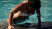 young-woman-diving-into-swimming-pool-super-slow-motion-