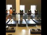 Gym Enthusiast Prepares for Competition Using Multiple Treadmills