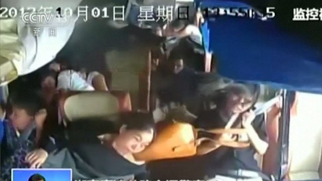 Terrifying moment bus topples over on China highway