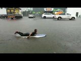 Surfer Takes to Flooded Streets as Storm Hits Durban