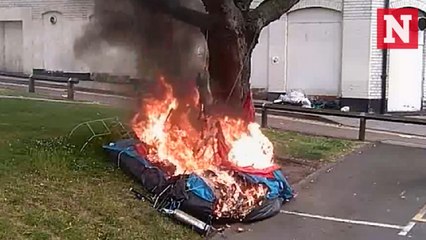 CCTV shows arsonist setting homeless man's tent on fire while he was inside