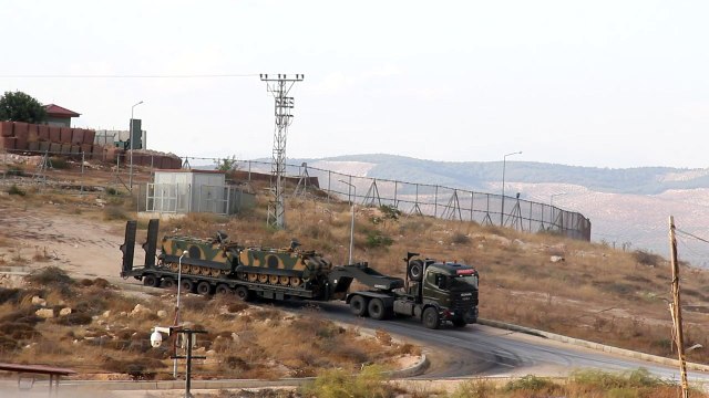 Turkish troops man position along Syria border