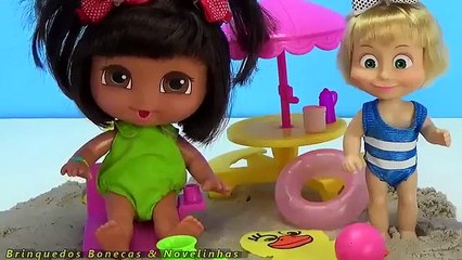 Masha Baby Dora a Aventureira brincando na Praia com animais de areia massinha kinetic sand Animais