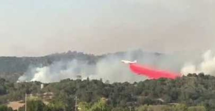 Evacuated Family Watches Giant 747 Drop Retardant Over California Wildfires