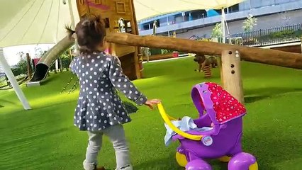 Little Girl Pushing Peppa Pig Stroller / Playground / Having Fun with Baby Doll