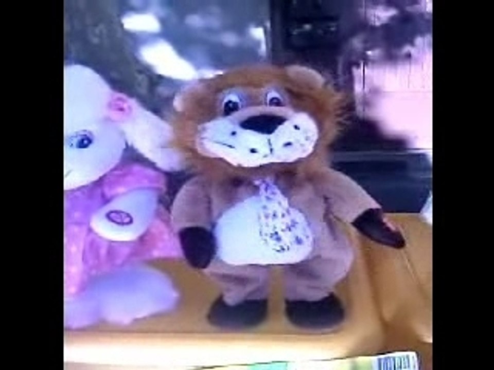PELUCHE AUTOMATE LION DANSEUR