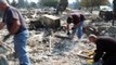 California residents search for belongings among wildfire ashes