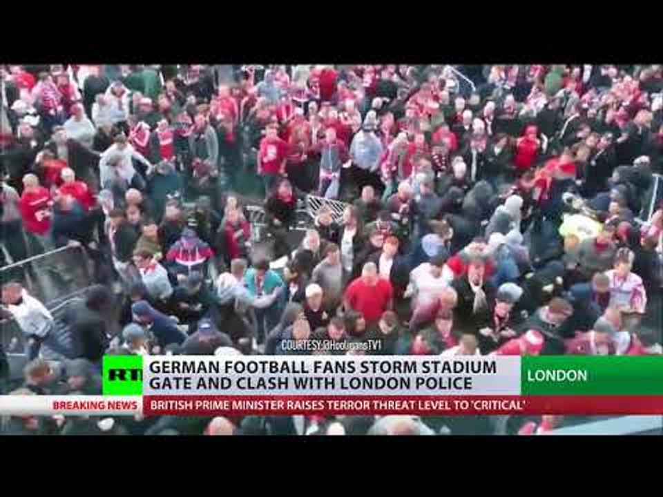 'We're back': German football fans storm stadium gate & clash with London police