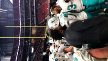 Dolphins huddle up before game vs. Falcons