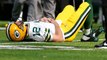 Aaron Rodgers goes to sideline after hit by Anthony Barr